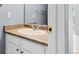 Bathroom featuring a sink with a cabinet, a mirror, and a cream countertop at 2691 E 132Nd Ave, Thornton, CO 80241