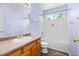 Bathroom featuring a white bathtub, a window, and a vanity with sink at 2691 E 132Nd Ave, Thornton, CO 80241