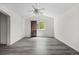 Spacious bedroom with grey vinyl floors, vaulted ceiling, and a window with natural light at 2691 E 132Nd Ave, Thornton, CO 80241