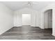 View of the spacious bedroom, with grey vinyl floors and double doors that open out at 2691 E 132Nd Ave, Thornton, CO 80241