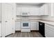 Well-lit kitchen with white appliances, ample counter space, and plenty of storage at 2691 E 132Nd Ave, Thornton, CO 80241