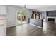 Bright living area features wood flooring, a ceiling fan, and sliding glass doors to the backyard at 2691 E 132Nd Ave, Thornton, CO 80241