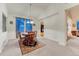 Cozy dining area with bright natural light, a round table, and views into other rooms at 7454 Snow Lily Pl, Castle Pines, CO 80108