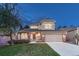 Beautiful home with a manicured lawn and a welcoming entrance, perfect for a growing Gathering at 7454 Snow Lily Pl, Castle Pines, CO 80108
