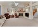 Inviting living room boasts a cozy fireplace, plush seating, and an open layout at 7454 Snow Lily Pl, Castle Pines, CO 80108