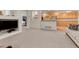Cozy living room and kitchen area featuring modern decor and an open floor plan at 7454 Snow Lily Pl, Castle Pines, CO 80108