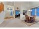 Open-concept living space with hardwood floors, bright lighting, and easy access to other rooms at 7454 Snow Lily Pl, Castle Pines, CO 80108