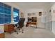 Comfortable office space with natural light, a desk, office chair, and carpeted flooring at 7454 Snow Lily Pl, Castle Pines, CO 80108