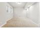 Bright and airy basement space with neutral carpet and large window for natural light at 2319 Decatur St, Denver, CO 80211