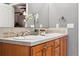 Bathroom vanity featuring double sinks, tile backsplash, and lots of counter space at 2319 Decatur St, Denver, CO 80211