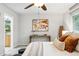 Cozy bedroom with a decorative table, neutral colors, plush carpet and a ceiling fan at 2319 Decatur St, Denver, CO 80211