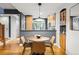 Eat-in kitchen dining space with hardwood floors and modern lighting at 2319 Decatur St, Denver, CO 80211
