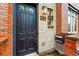 Close-up of a modern front door with brick accents and house number visible at 2319 Decatur St, Denver, CO 80211