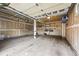 Spacious unfinished garage with ample storage shelving, providing a blank canvas for customization and organization at 2319 Decatur St, Denver, CO 80211