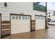 Two-car garages with brick accents and matching address numbers at 2319 Decatur St, Denver, CO 80211