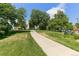 Scenic view of Jefferson Park with lush green grass, walking paths, and mature trees at 2319 Decatur St, Denver, CO 80211