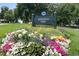 Jefferson Park sign with colorful flower bed in the foreground on a sunny day at 2319 Decatur St, Denver, CO 80211