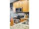 Close up of stainless appliances, granite countertops and stylish hardwood floors at 2319 Decatur St, Denver, CO 80211