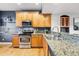 Well-equipped kitchen with stainless steel appliances and granite countertops at 2319 Decatur St, Denver, CO 80211