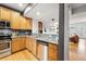 Modern kitchen with stainless steel appliances and hardwood floors at 2319 Decatur St, Denver, CO 80211