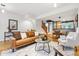 Bright open concept living room with hardwood floors and comfortable seating at 2319 Decatur St, Denver, CO 80211
