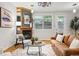 Bright living room with hardwood floors, fireplace, and modern furnishings at 2319 Decatur St, Denver, CO 80211