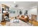 Stylish living room with hardwood floors, fireplace, and modern furnishings at 2319 Decatur St, Denver, CO 80211