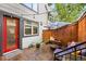 Cozy patio area with string lights, outdoor seating, and privacy fence at 2319 Decatur St, Denver, CO 80211
