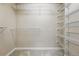 Spacious walk-in closet featuring ample shelving for optimal storage and organization at 2319 Decatur St, Denver, CO 80211