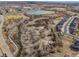 Aerial view of a neighborhood with a pond and open space at 17623 Cornish Pl, Parker, CO 80134