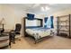 Bedroom featuring a murphy bed, desk, and shelving providing optimal space utilization at 17623 Cornish Pl, Parker, CO 80134