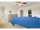 Bedroom featuring a bed, dresser, and a walk-in closet at 17623 Cornish Pl, Parker, CO 80134