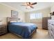 Bedroom featuring a bed, ceiling fan, and natural light from a window at 17623 Cornish Pl, Parker, CO 80134