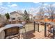 Cozy deck with outdoor seating, a grill, and a fire pit, perfect for entertaining at 17623 Cornish Pl, Parker, CO 80134