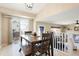 Dining area featuring a sliding glass door and a modern wooden table and chairs at 17623 Cornish Pl, Parker, CO 80134