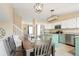 Open kitchen area features stainless steel appliances, granite countertops and modern pendant lighting at 17623 Cornish Pl, Parker, CO 80134