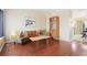 Inviting living room with hardwood floors, stylish furniture, and a charming display cabinet at 17623 Cornish Pl, Parker, CO 80134