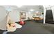 Finished basement area set up as a playroom with decorative wigwam and carpeted floor at 1920 S Niagara St, Denver, CO 80224