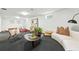 Spacious finished basement showcasing seating, a unique coffee table, and neutral decor at 1920 S Niagara St, Denver, CO 80224