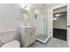 Contemporary bathroom featuring a glass-enclosed shower, stylish vanity, and mosaic tile flooring at 1920 S Niagara St, Denver, CO 80224