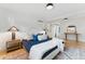 Cozy bedroom featuring stylish decor, comfortable bedding, and view into another room adding depth and interest at 1920 S Niagara St, Denver, CO 80224