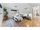 Bright bedroom featuring stylish decor, a comfortable bed, and a view into another room enhancing spaciousness at 1920 S Niagara St, Denver, CO 80224