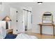 Bedroom view features stylish decor and a glimpse into other rooms enhancing the sense of space and flow at 1920 S Niagara St, Denver, CO 80224