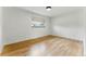 Sunlit bedroom features hardwood floors and a view of the outdoors, creating a bright and airy space at 1920 S Niagara St, Denver, CO 80224