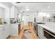 Modern kitchen featuring white cabinetry, stainless steel appliances, and stylish decor at 1920 S Niagara St, Denver, CO 80224