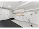 Bright laundry room with built-in cabinets, ample counter space, and modern fixtures at 1920 S Niagara St, Denver, CO 80224