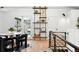 Stylish living room featuring a decorative shelving unit, dining area, and modern decor at 1920 S Niagara St, Denver, CO 80224