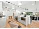 Open-concept living area with modern kitchen and view into dining and living spaces at 1920 S Niagara St, Denver, CO 80224