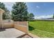 Back patio area features lovely green space and mountain views in a private setting at 3179 S Indiana St, Lakewood, CO 80228