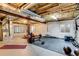 Finished basement featuring a home gym with free weights, weight bench, and mirrors at 3179 S Indiana St, Lakewood, CO 80228